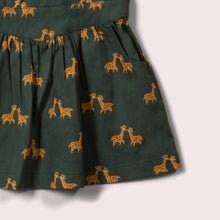 Lade das Bild in den Galerie-Viewer,       Little-Green-Radicals-Green-And-Yellow-Pinafore-Dress-With-Giraffe-Print-Closeup-View
