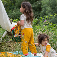 Lade das Bild in den Galerie-Viewer,       Little-Green-Radicals-Yellow-And-Pink-Reversible-Trousers-Kid-Back
